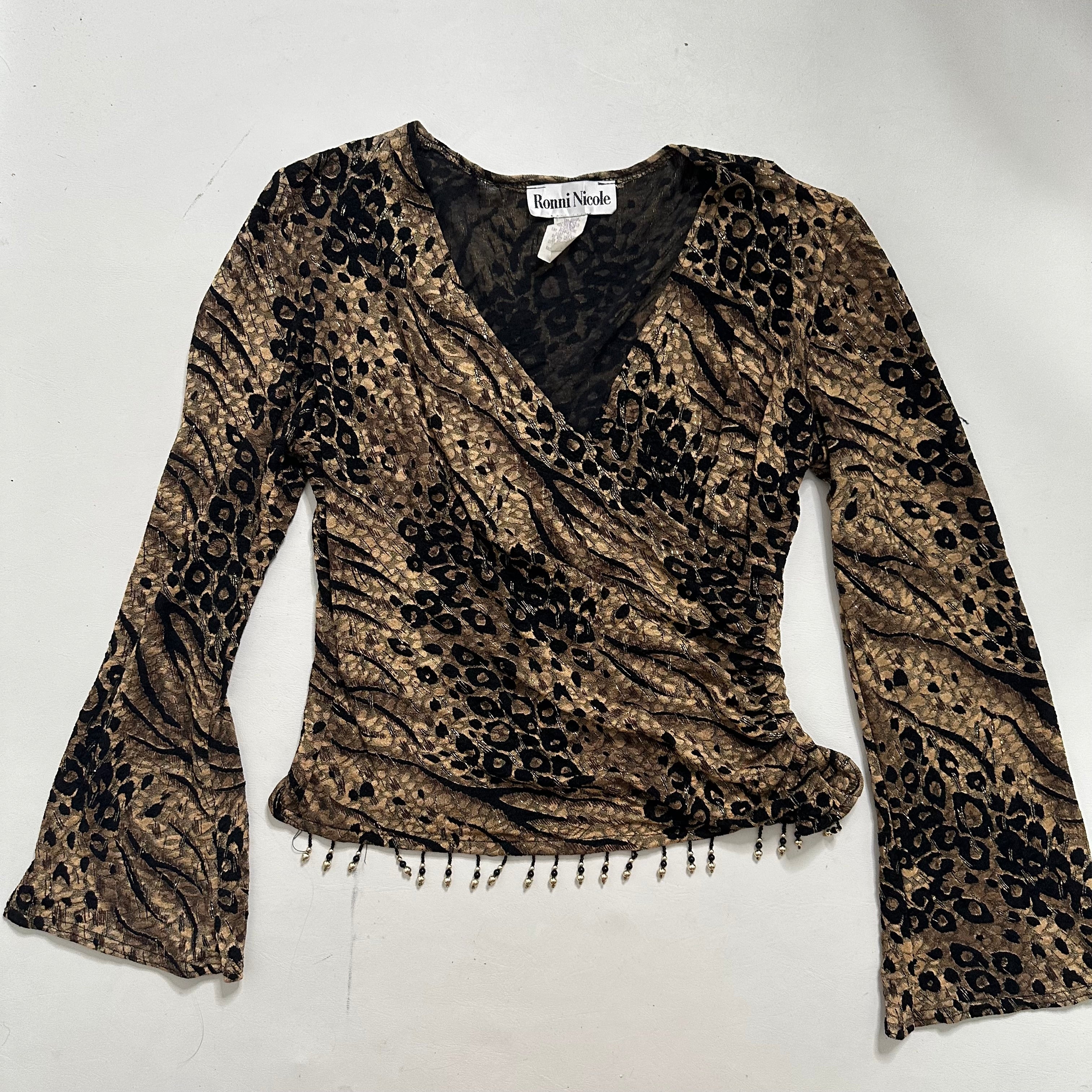 Wrap over animal print top with beads