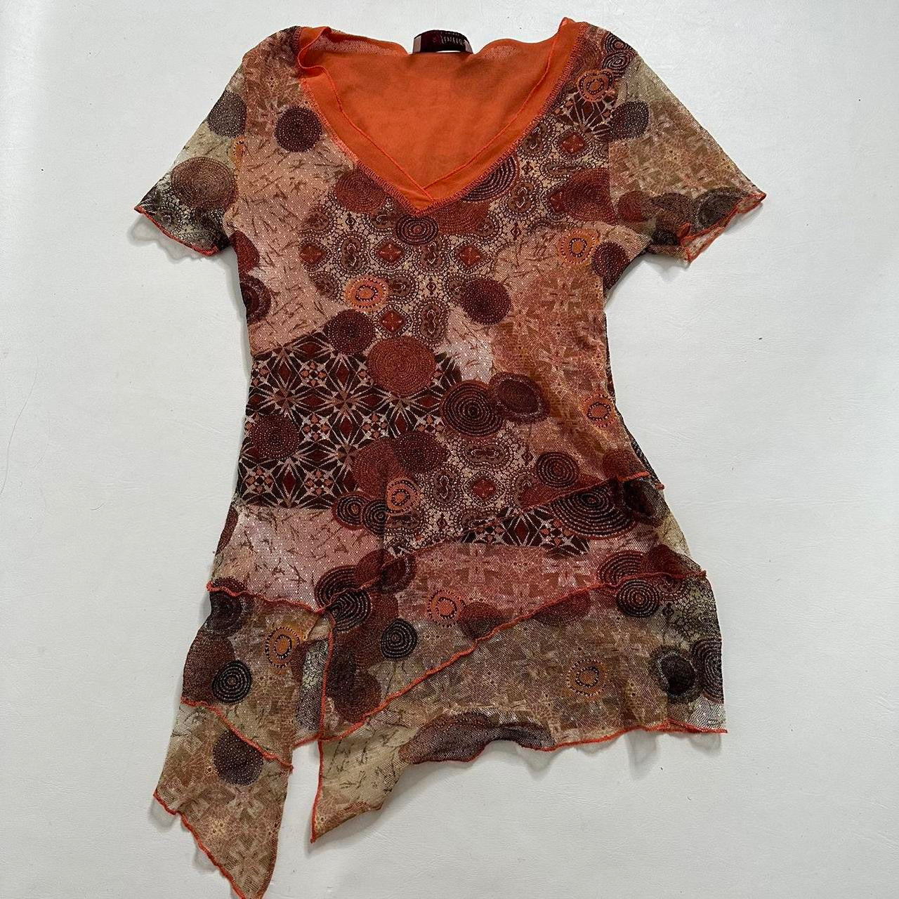 Mesh asymmetrical top