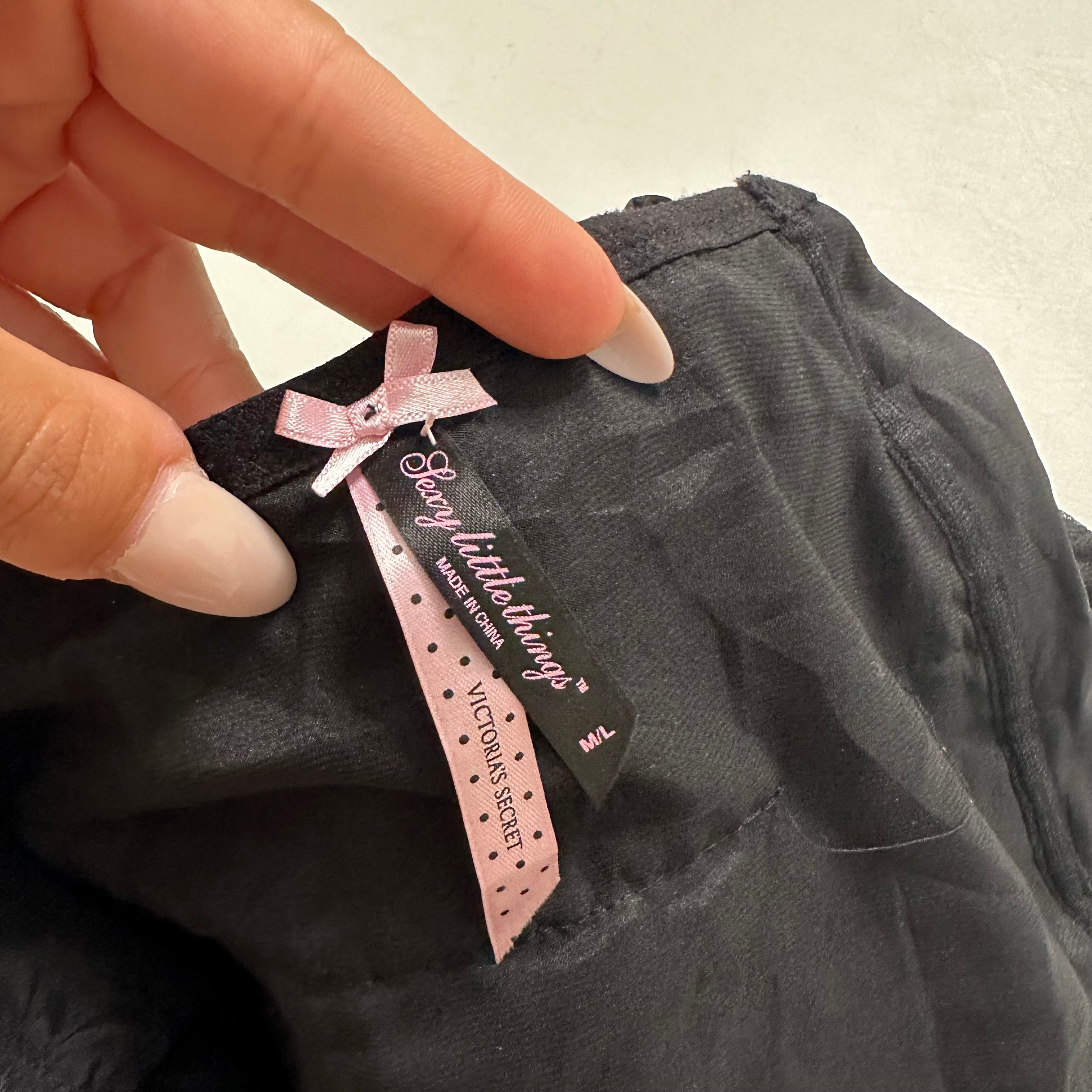 Viral Victoria’s Secret black low rise mini skirt with bow detail